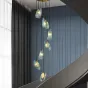 Каскадная комбинация светильников с рельефными стеклянными рассеивателями голубого цвета форме изогнутых лепестков LUCIA COMBO L7