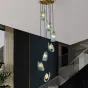 Каскадная комбинация светильников с рельефными стеклянными рассеивателями голубого цвета форме изогнутых лепестков LUCIA COMBO L7