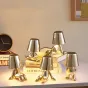 Серия настольных светодиодных ламп для детской с коническими абажурами и основанием в виде человечков в разных позах ELF C