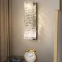 Настенный светодиодный светильник с прямоугольным плафоном из составных хрустальных слитков на хромированном основании CARE WALL H45 Gold