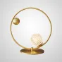 Серия настольных ламп с шарообразным плафоном с кристаллическим рельефом и декоративными металлическими шарами на замкнутом круглом каркасе HOOP TAB LUX D35