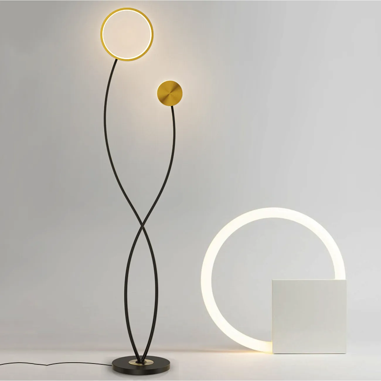 Светодиодный торшер с двумя плафонами в виде светящегося кольца и диска на перекрещенных изогнутых стойках HALEY 3000К