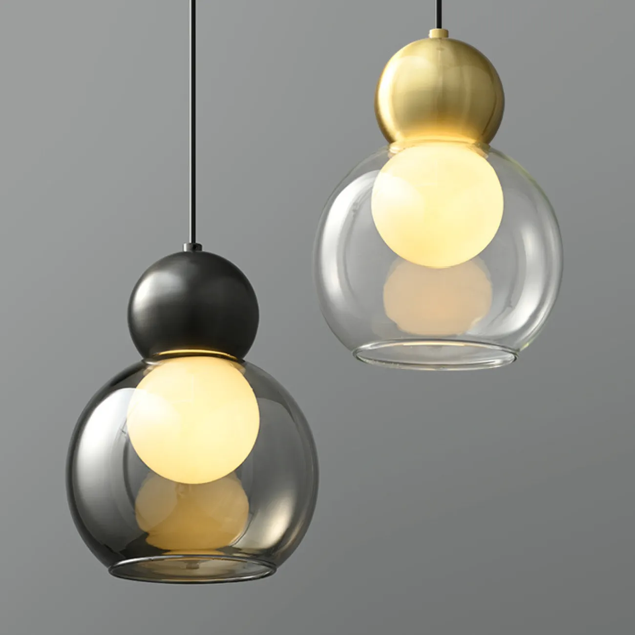 Готовая комбинация подвесных светильников с двумя шарообразными плафонами в стеклянном корпусе из дымчатого и прозрачного стекла FANUEL DUO Brass