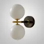 Серия настенных светильников с белым матовым плафоном шарообразной формы на черном кронштейне с латунной отделкой LOIS L2