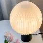 Настольная лампа с округлым плафоном из белого рельефного стекла на черном цилиндрическом основании VICCI