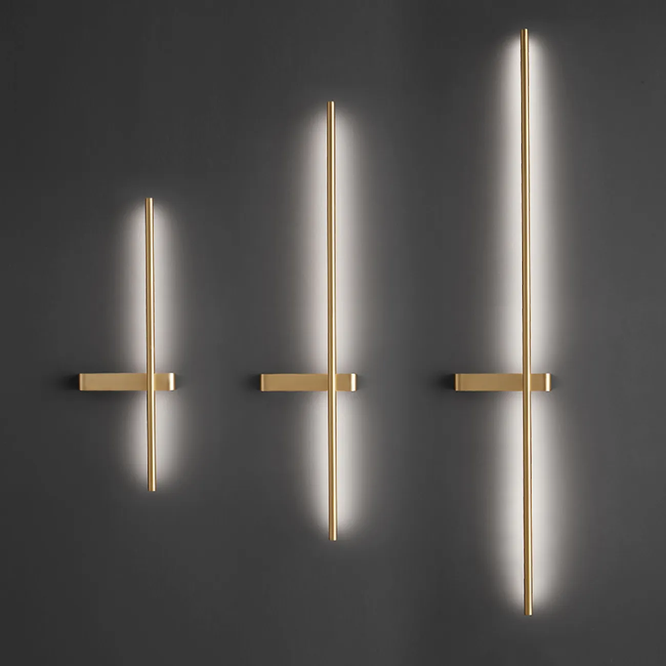 Серия парных настенных светильников в виде светящегося стержня из настоящей и черненой латуни GIA PAIR H60 Left Black