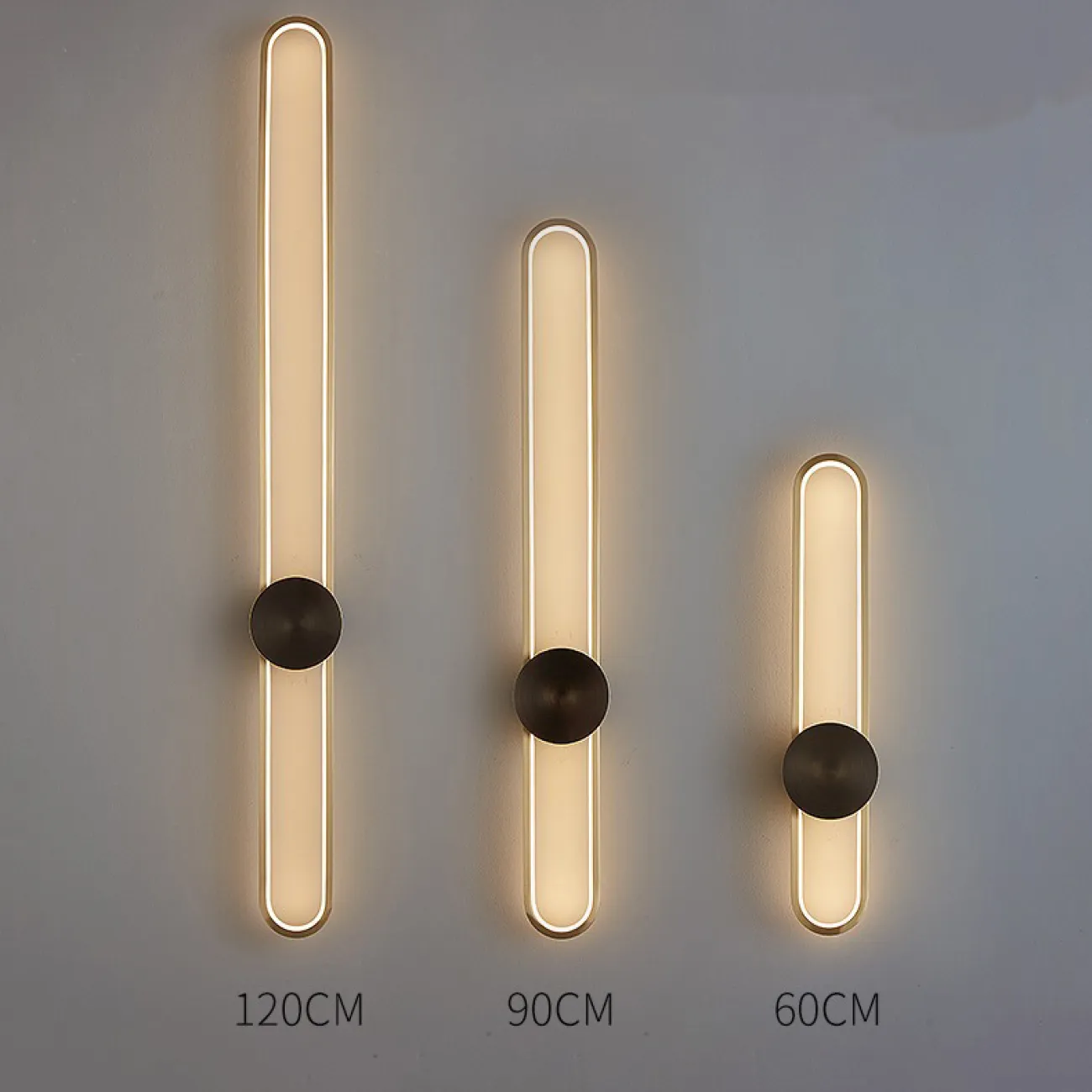 Серия настенных светодиодных светильников с латунным диском на вытянутом закольцованном корпусе HEIDY L H90 Brass Black