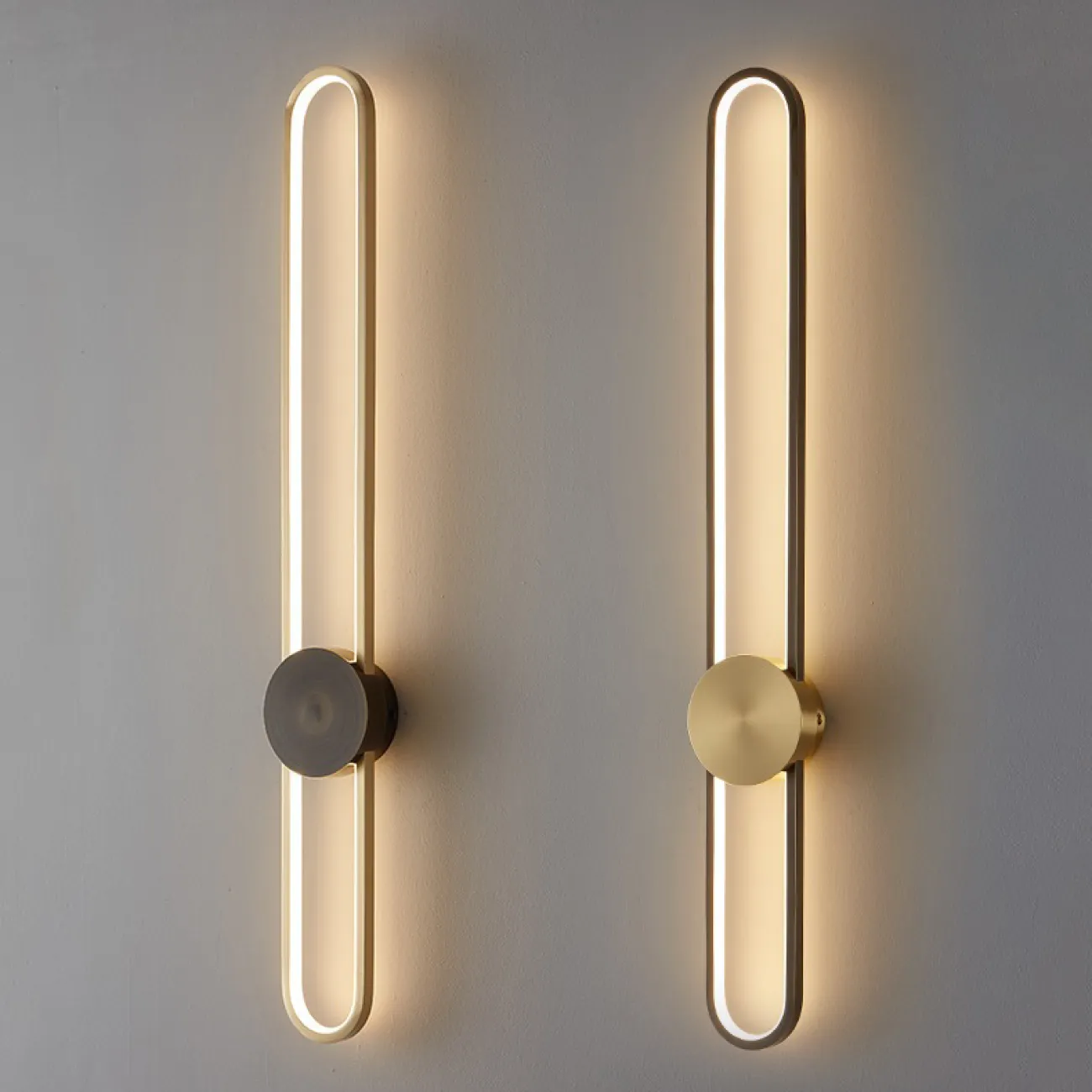 Серия настенных светодиодных светильников с латунным диском на вытянутом закольцованном корпусе HEIDY L H90 Brass Black