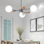 Линейка люстр в скандинавском стиле с шарообразными плафонами на металлической штанге и с деревянным декором MEADE ORB